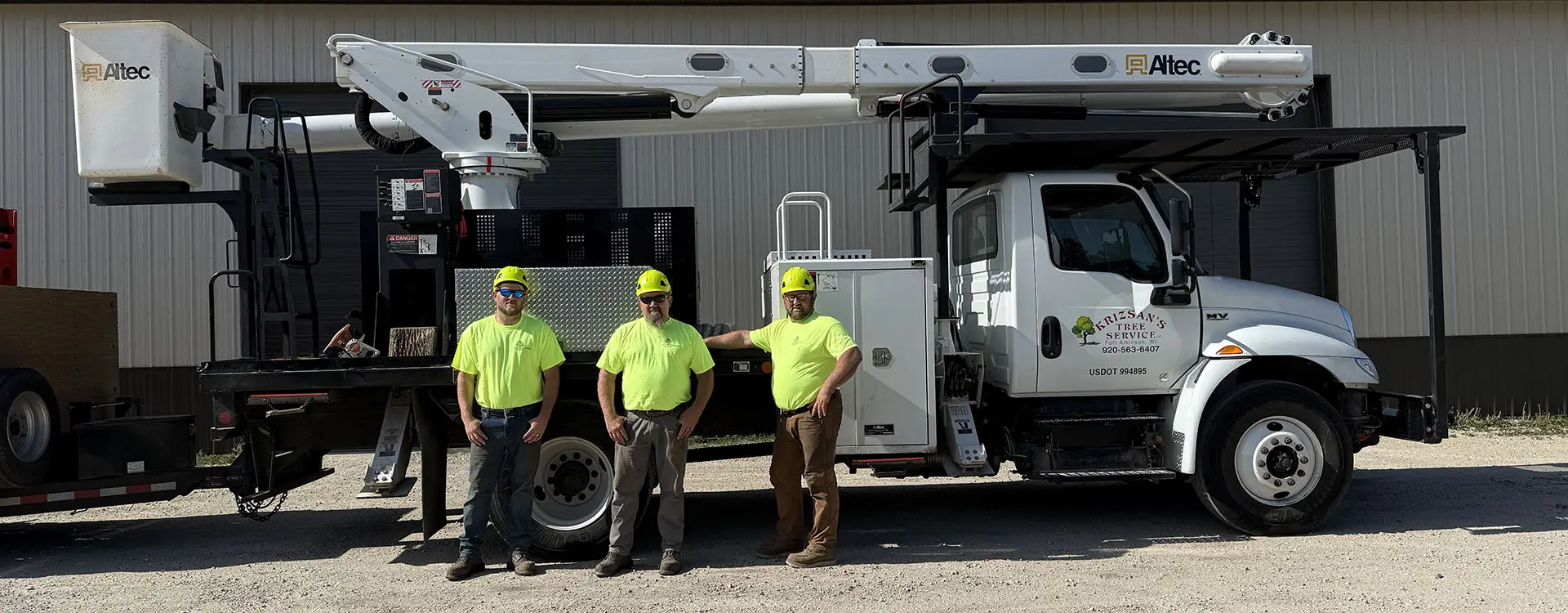 Tree service crew with bucket truck